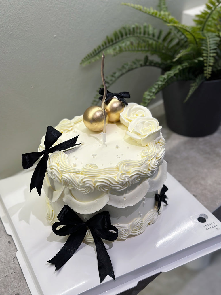 White Rosette Ribbon Cake